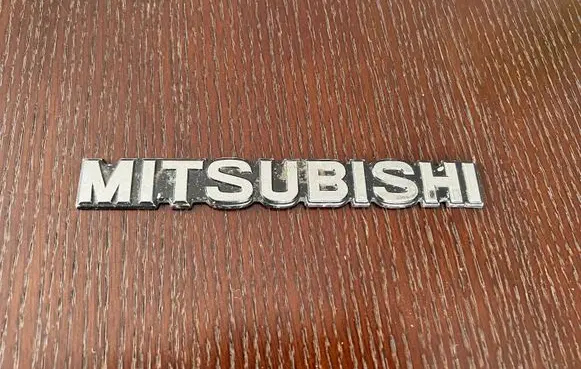 Mitsubishi Lancer Manufacturers badge/model letters MB117150