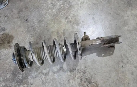 Opel Antara Front shock absorber with coil spring SA010B003 95147607 12L164229NA
