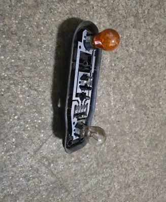 Tail light bulb cover holder