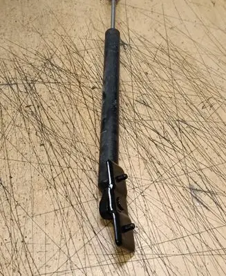 Front door check strap stopper