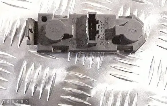 Tail light bulb cover holder