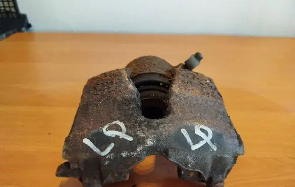 Opel Astra G Front brake caliper 