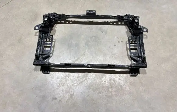 Radiator support slam panel