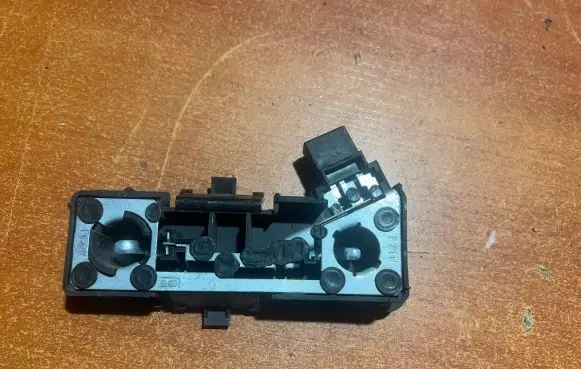 Tail light bulb cover holder
