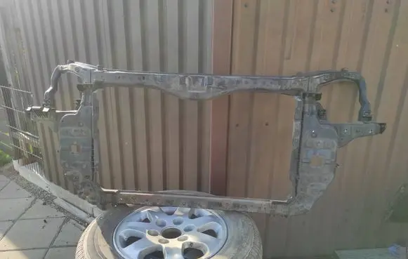 KIA Carens II Radiator support slam panel 641011D000