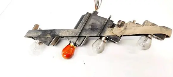 Tail light bulb cover holder