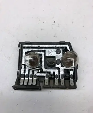 Tail light bulb cover holder
