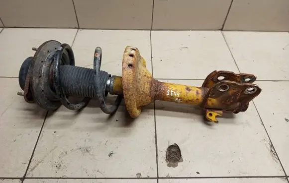 Subaru Legacy Front shock absorber with coil spring 