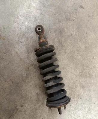 Nissan Navara D40 Front shock absorber with coil spring 
