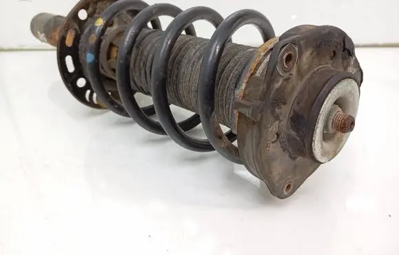 Volkswagen Caddy Front shock absorber with coil spring 1T0413031HQ 1K0412331C