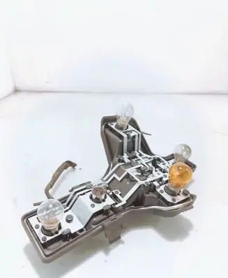 Tail light bulb cover holder
