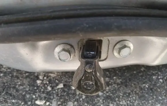 Front door check strap stopper