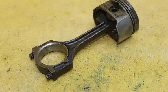 Piston with connecting rod