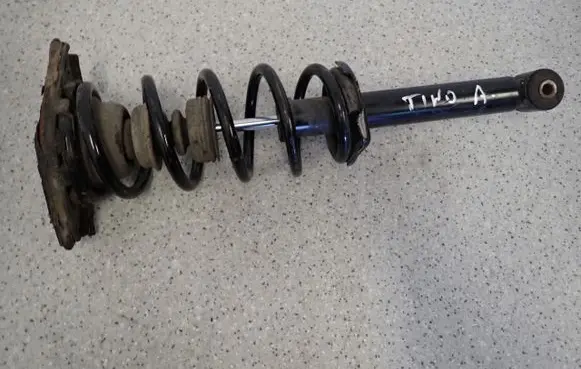 Nissan Almera Tino Front shock absorber with coil spring