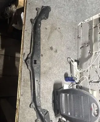Top upper radiator support slam panel