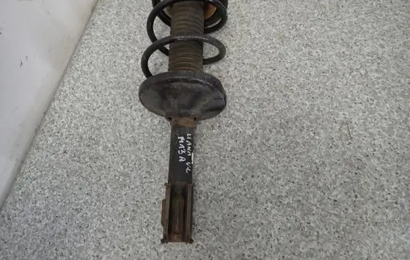 Suzuki Liana Front shock absorber with coil spring