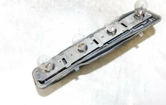 Ford Escort Tail light bulb cover holder