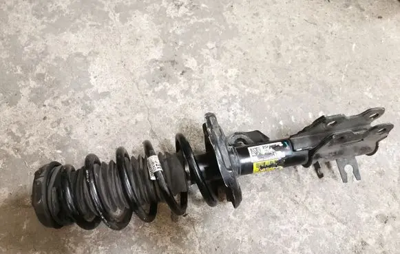 Front shock absorber with coil spring