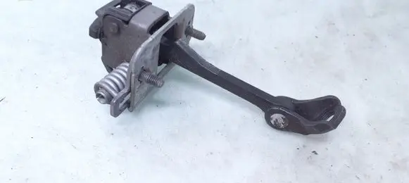 Front door check strap stopper