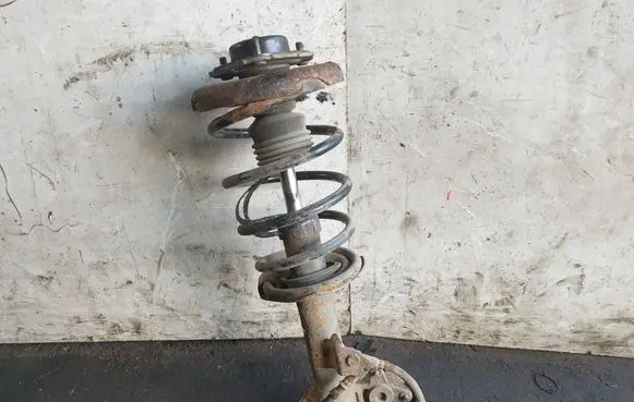 Nissan Primera Front shock absorber with coil spring