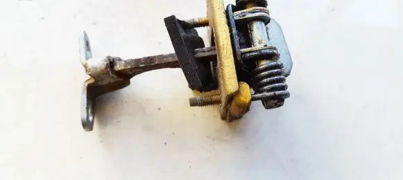 Front door check strap stopper