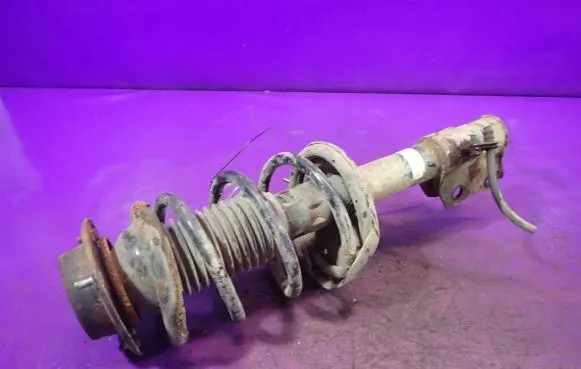 Front shock absorber with coil spring