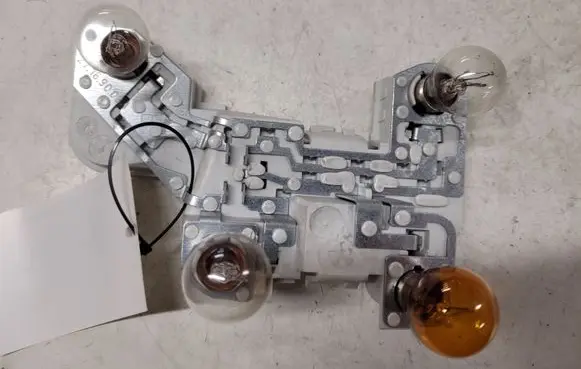 Volvo V50 Tail light bulb cover holder