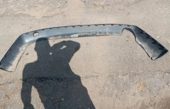 Rear bumper trim bar molding
