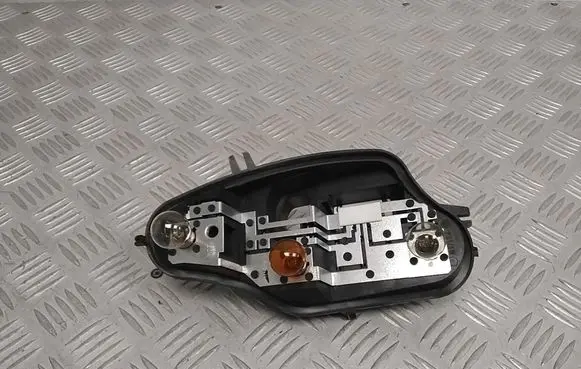 Tail light bulb cover holder