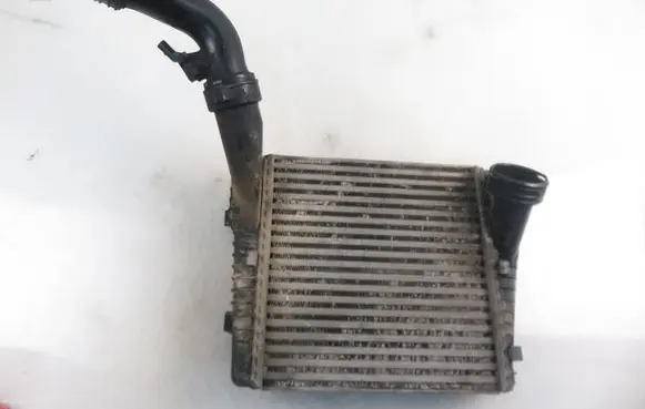 Volkswagen Touareg I Intercooler radiator 7L0145803A