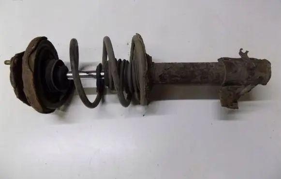 Nissan X-Trail T30 Front shock absorber with coil spring 879231kljiu56