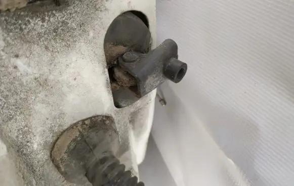 Front door check strap stopper