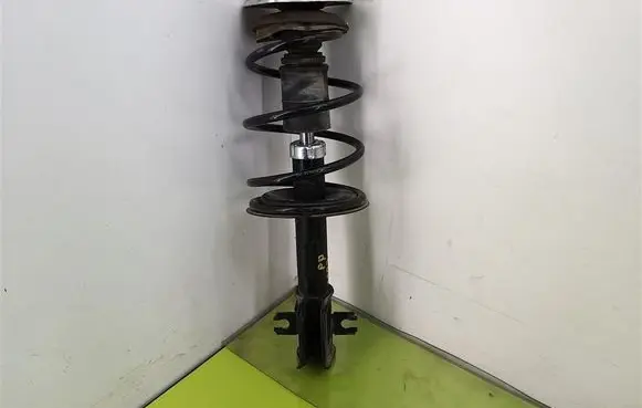 Front shock absorber with coil spring
