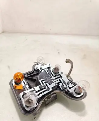 Tail light bulb cover holder