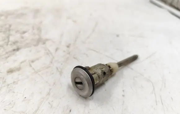 Datsun 100 Coupe door lock (next to the handle) NI835