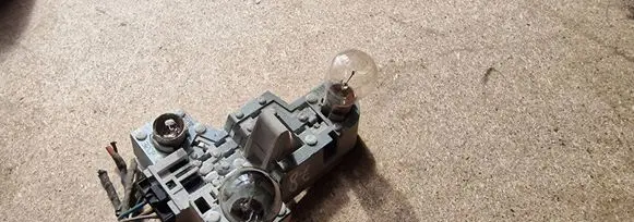 Tail light bulb cover holder