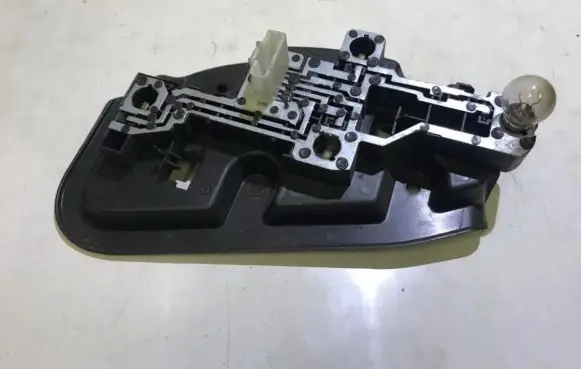 Tail light bulb cover holder
