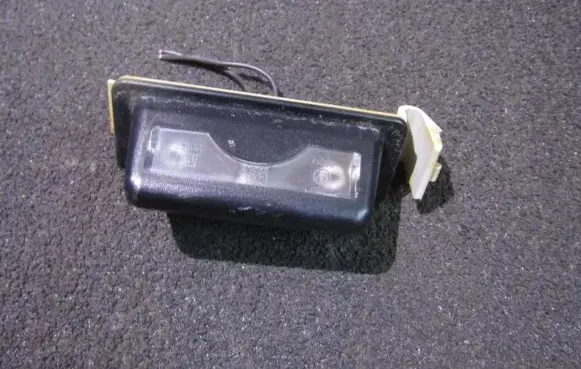Mazda 323 Number plate light 8245