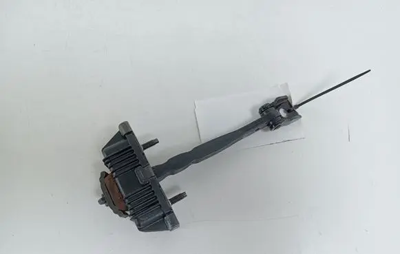 Front door check strap stopper