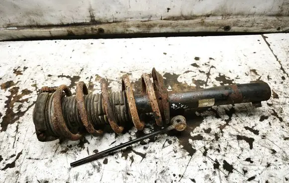 Volkswagen Caddy Front shock absorber with coil spring