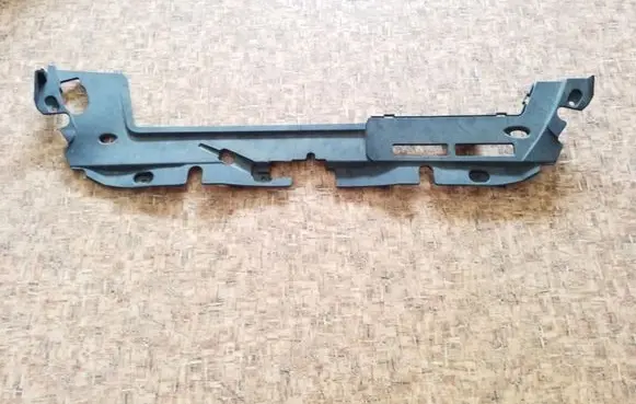 Engine bonnet/hood lock trim molding