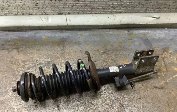Front shock absorber with coil spring