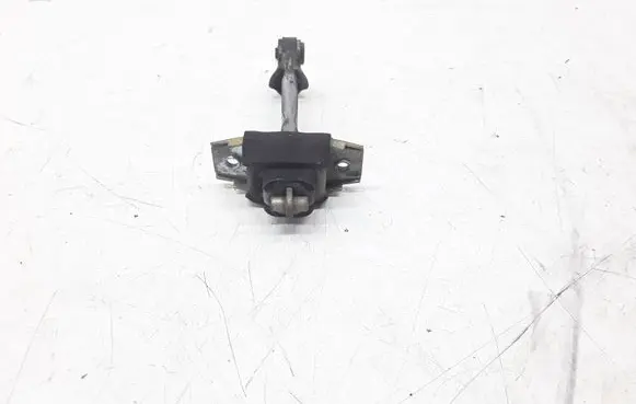 Front door check strap stopper