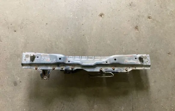 Top upper radiator support slam panel