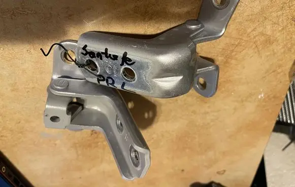 Hyundai Santa Fe Front door upper hinge A046057