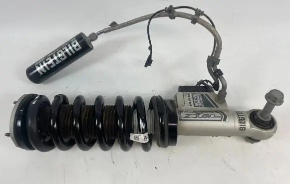 Ram 1500 Front shock absorber with coil spring 68574732AA