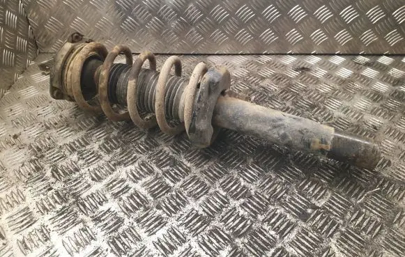 Volkswagen Caddy Front shock absorber with coil spring 1k0412303S