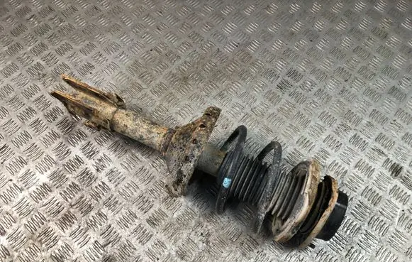 Subaru Impreza II Front shock absorber with coil spring