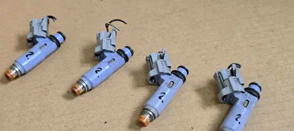 Suzuki Ignis Fuel injectors set 1571080G00 1571080G01