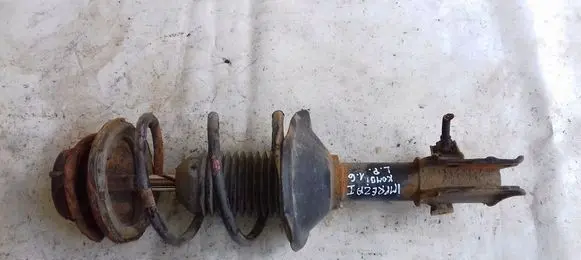 Subaru Impreza II Front shock absorber with coil spring